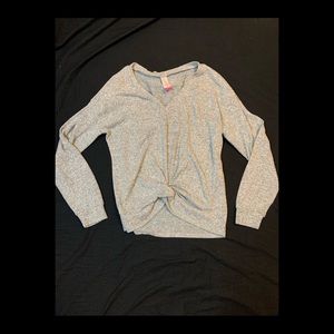 Size M. Long sleeve. Kind of cropped.